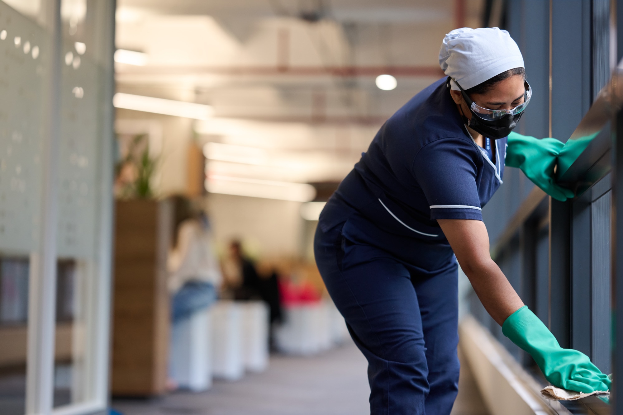 Woman Cleaning Hallway