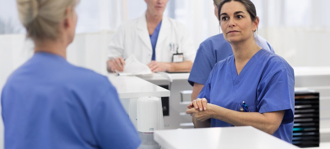 Nurse sanitizing hands