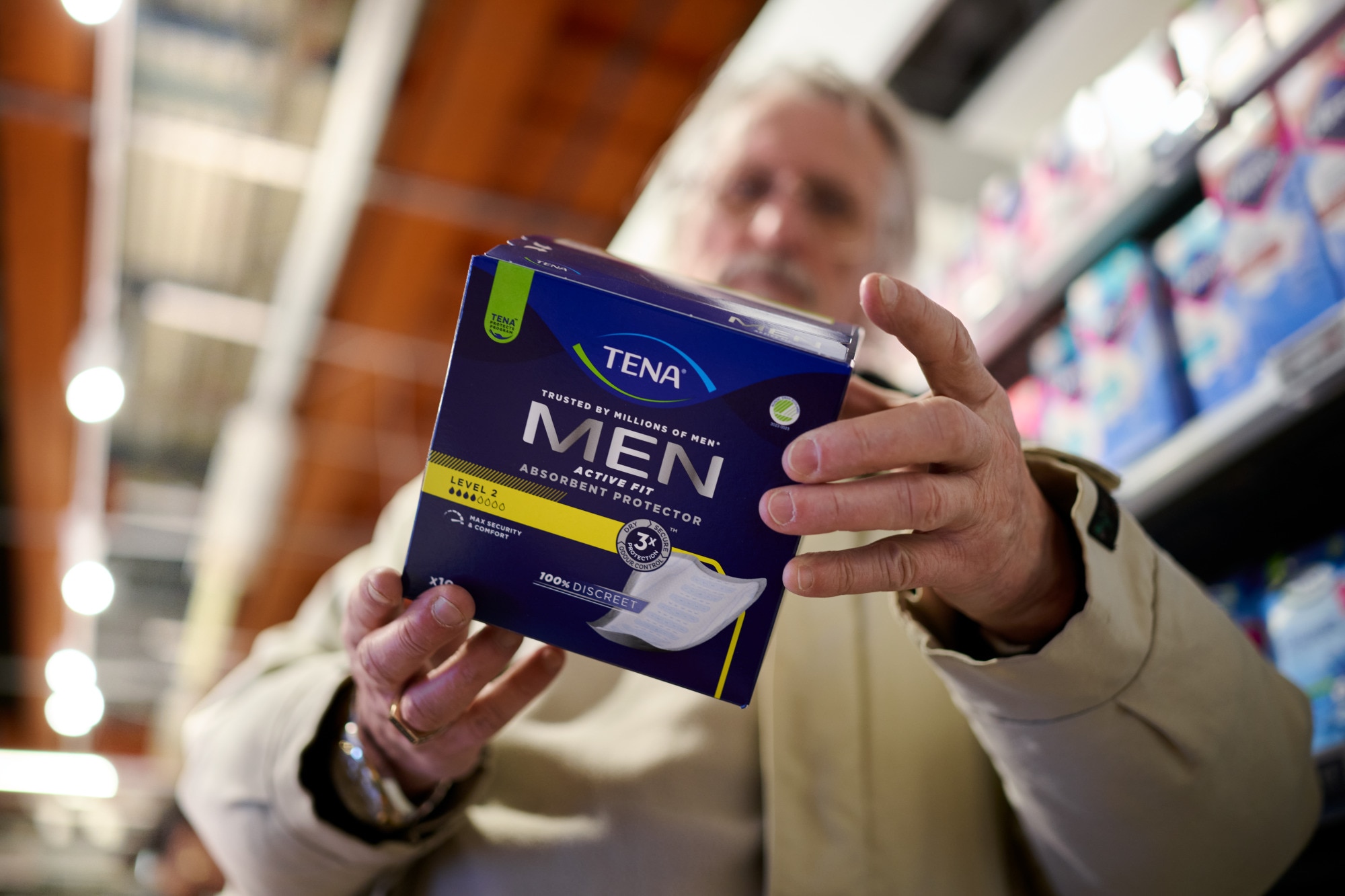 Man Holding Tena Product