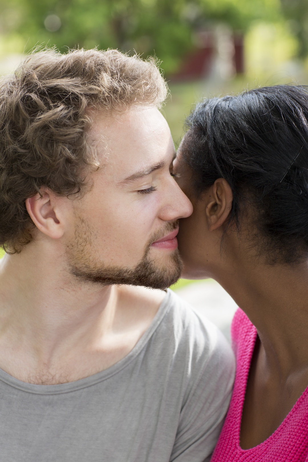 Young man & young woman close hug love