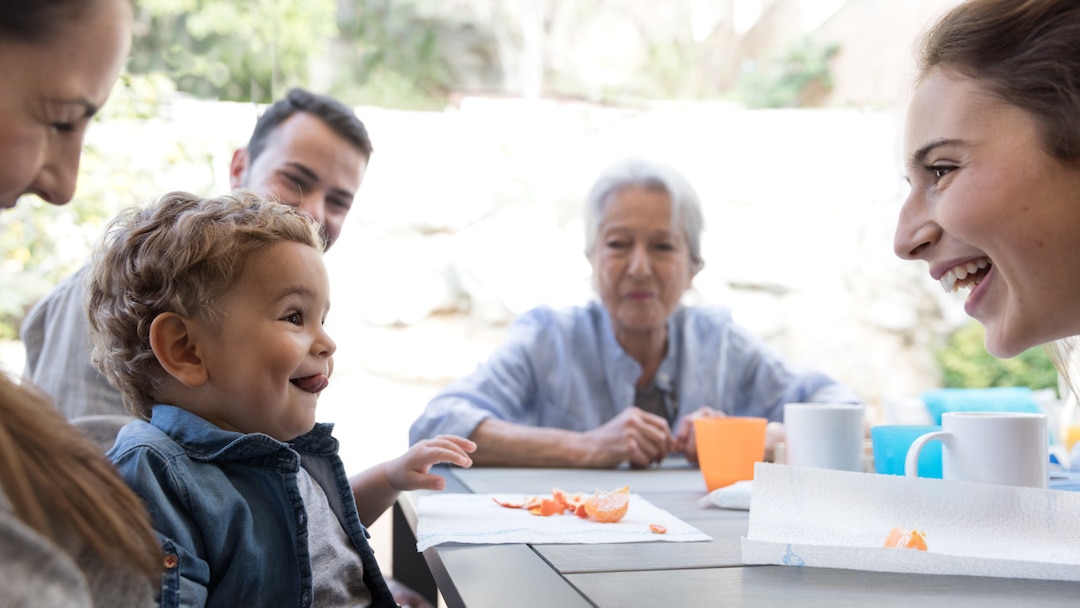 Family Eating Clementine On Terrace 4