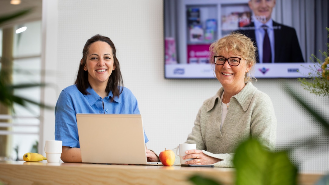 Women In Office Smiling